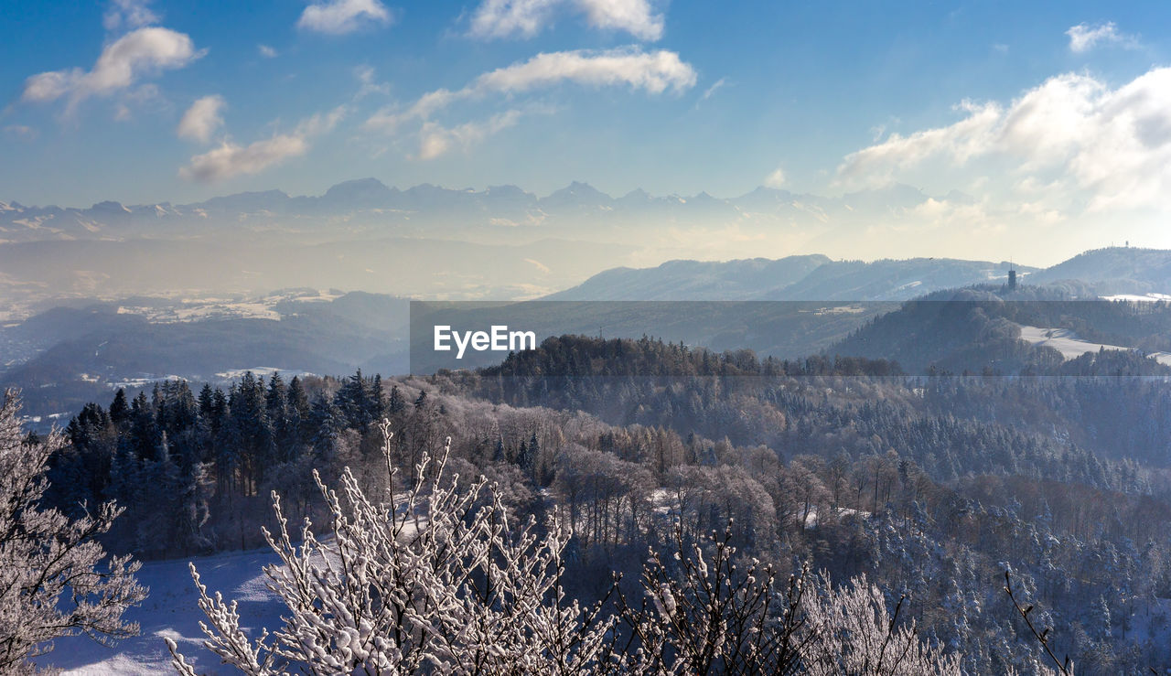 Scenic view of snowcapped mountains against sky