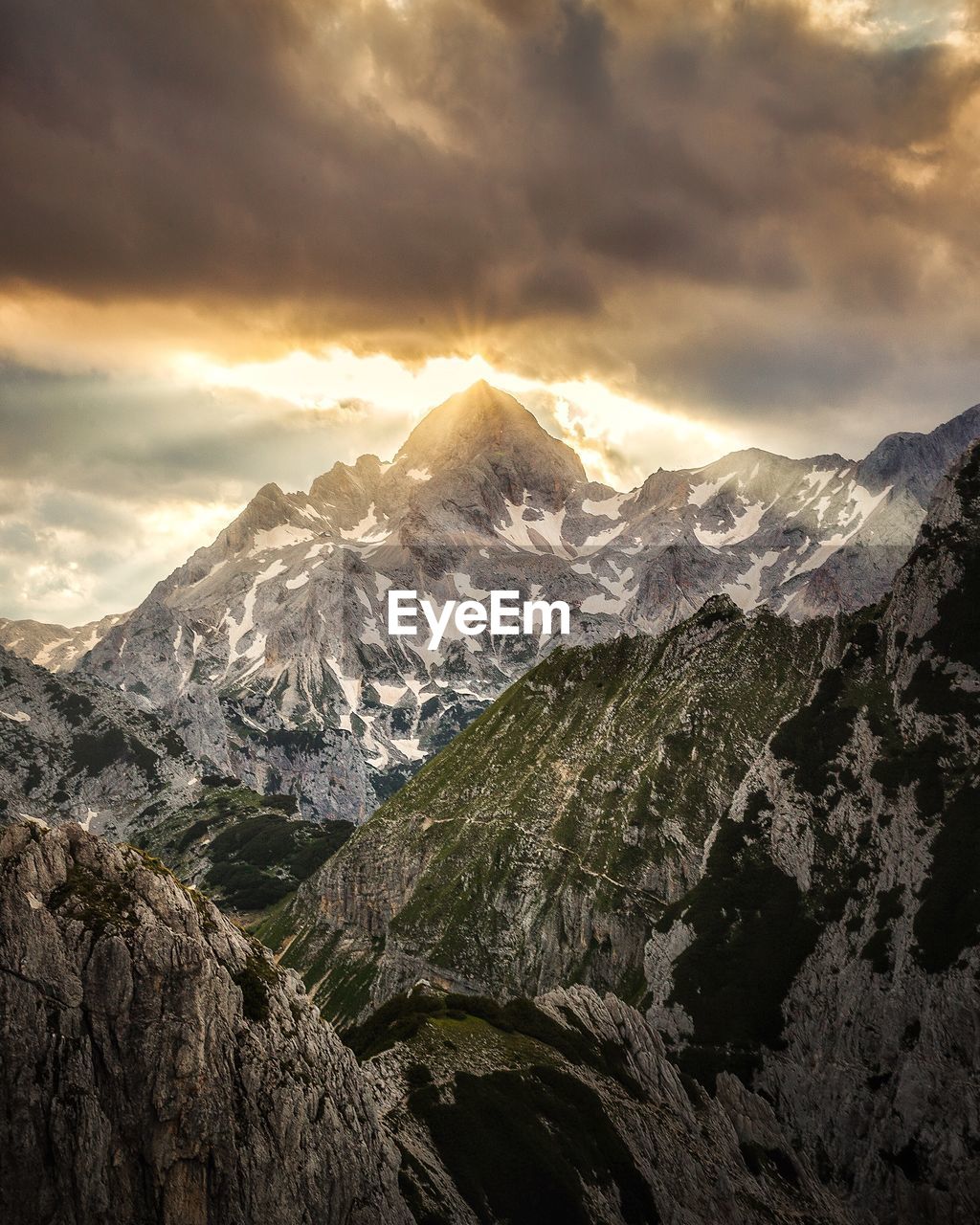 Scenic view of snowcapped mountains against sky during sunset