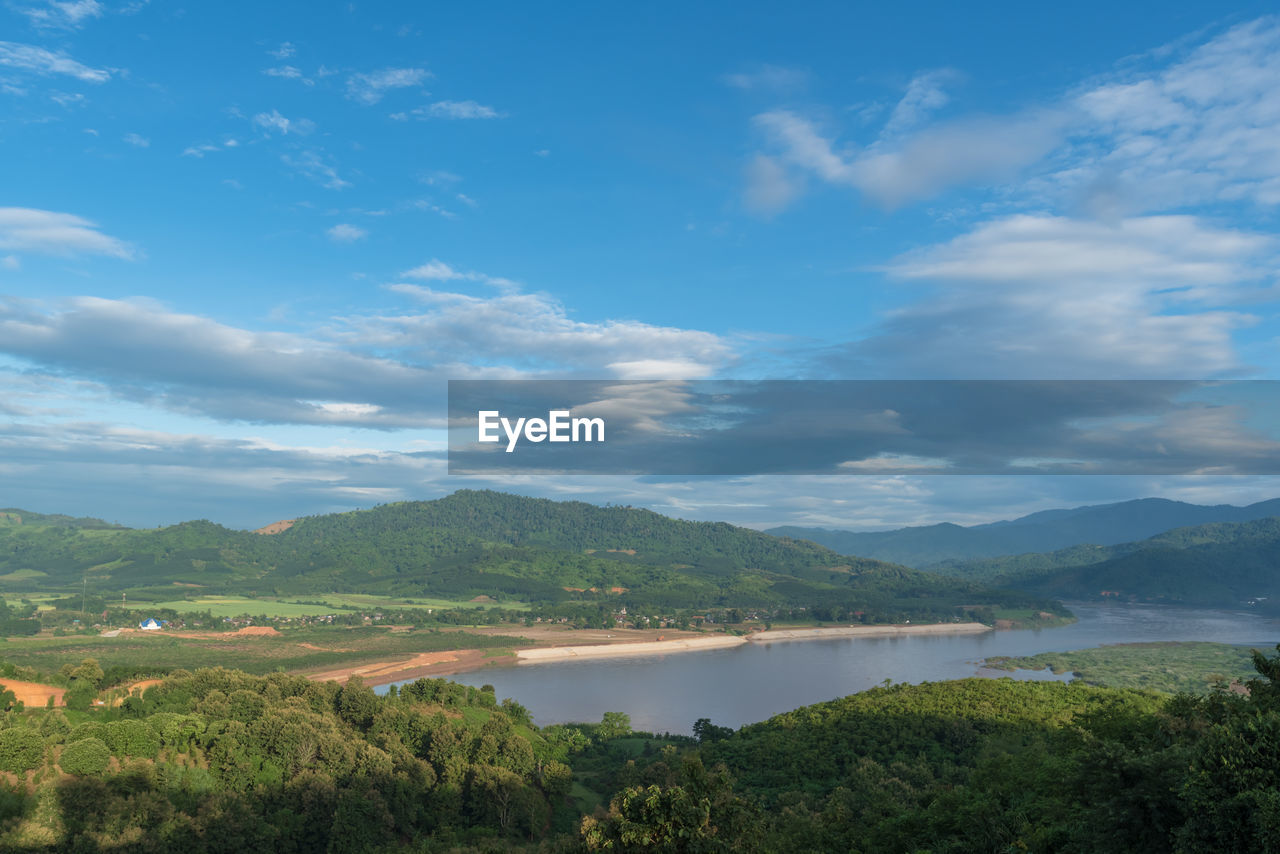 SCENIC VIEW OF LAKE BY TREES AGAINST SKY