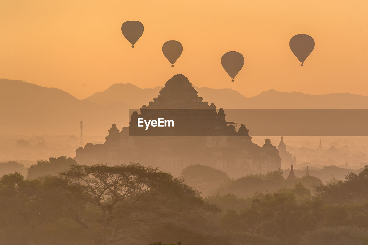 VIEW OF HOT AIR BALLOON AT SUNSET