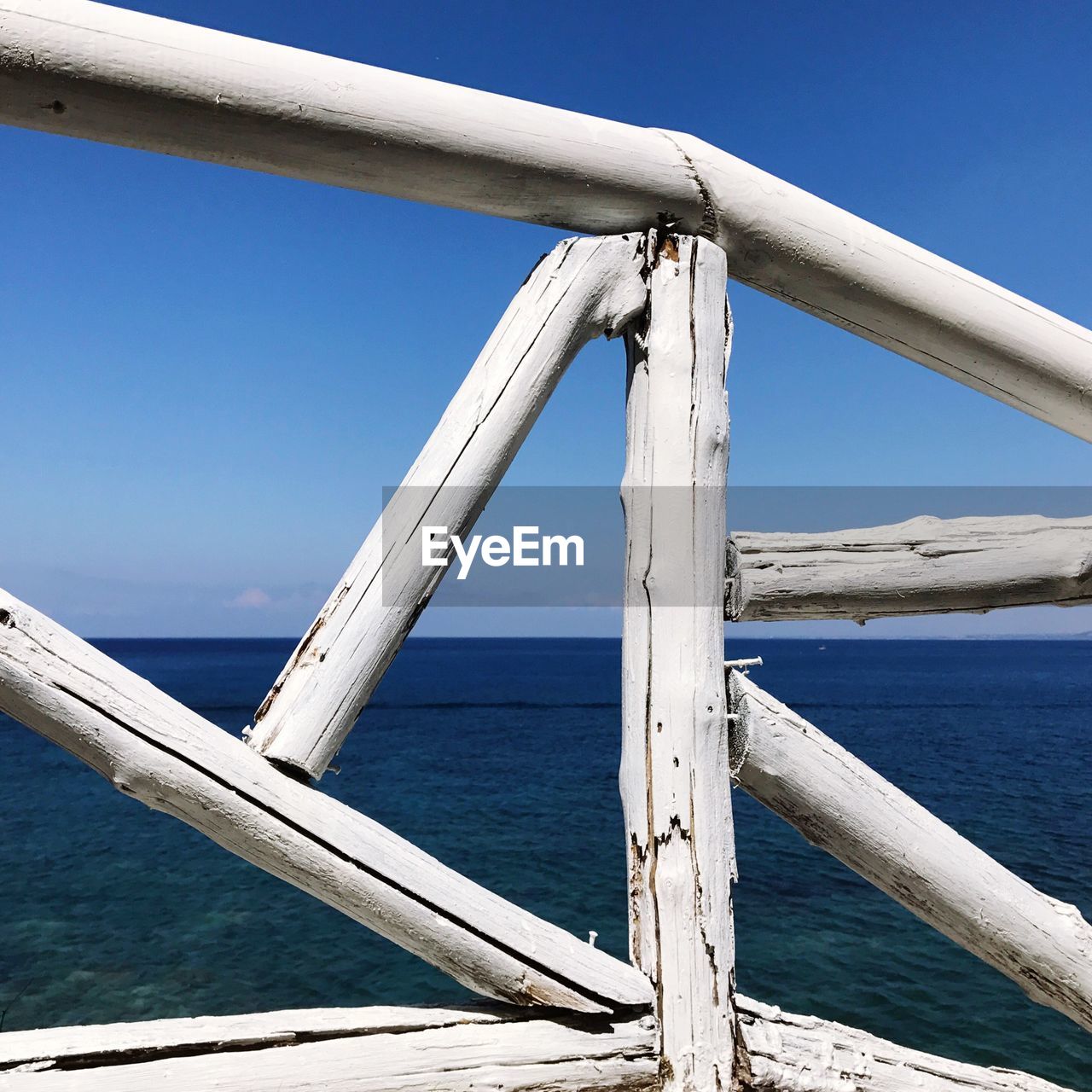 Close-up of boat against blue sea