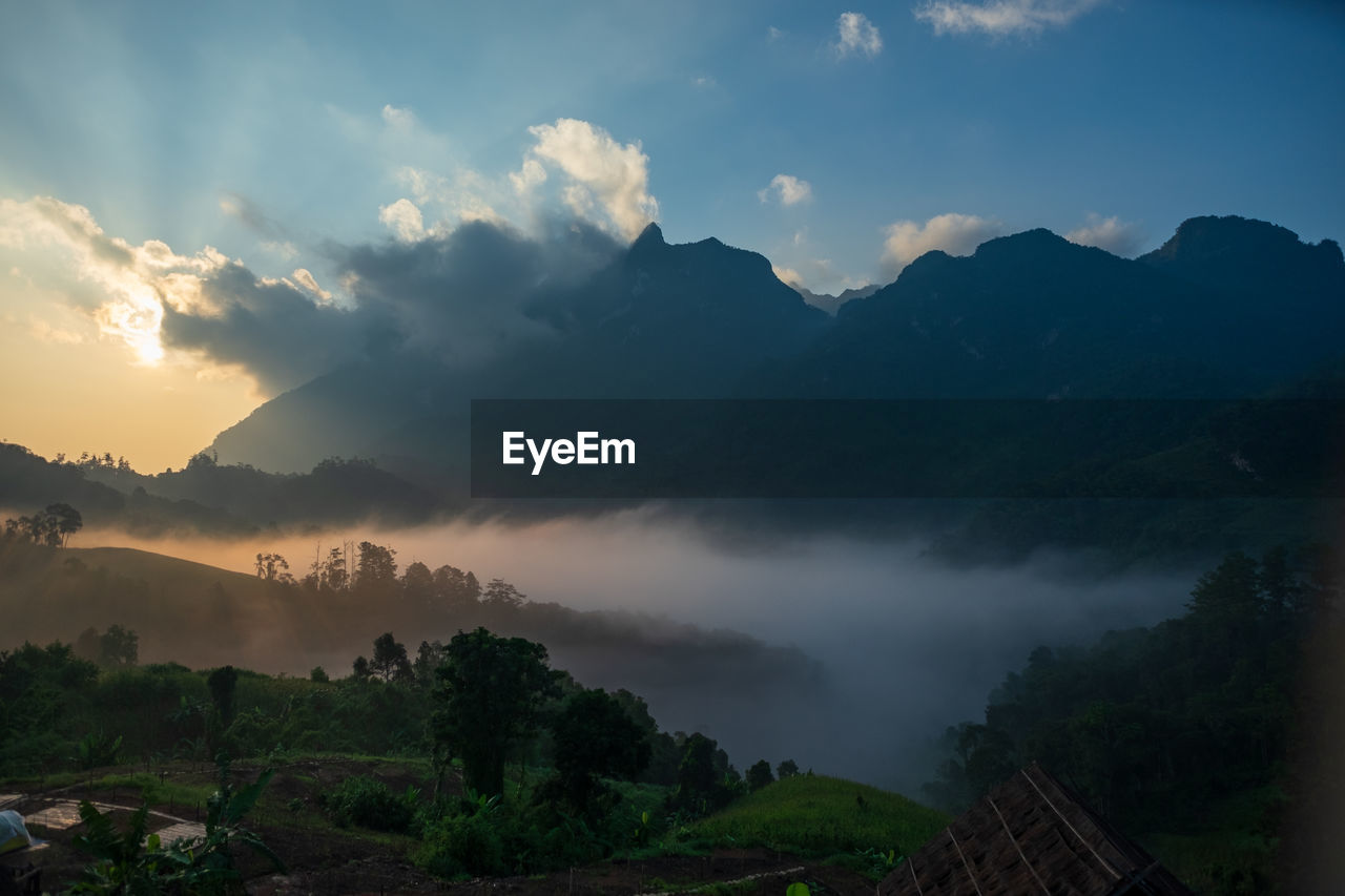 Scenic view of mountains against sky during sunset