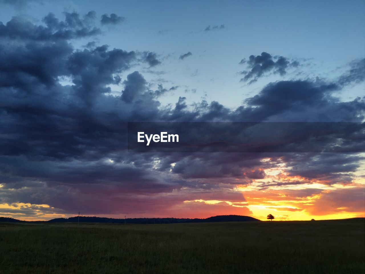 SCENIC VIEW OF DRAMATIC SKY DURING SUNSET