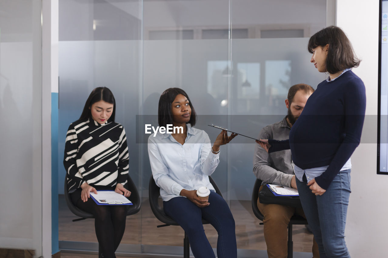 Candidates sitting on chair for interview