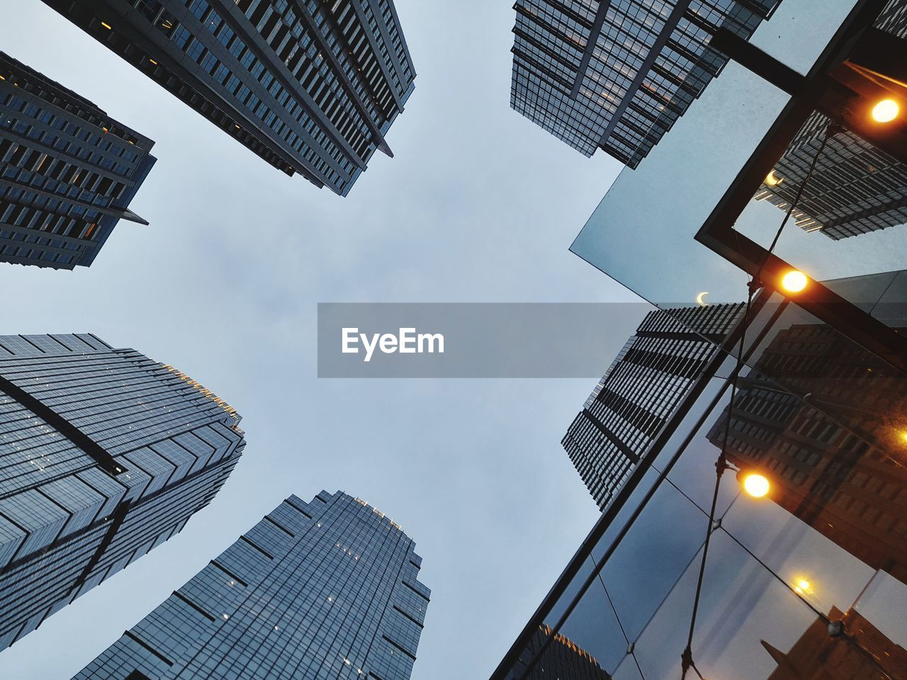 Low angle view of skyscrapers against sky at night