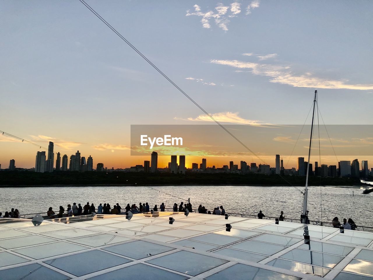 Scenic view of silhouette buildings against sky during sunset