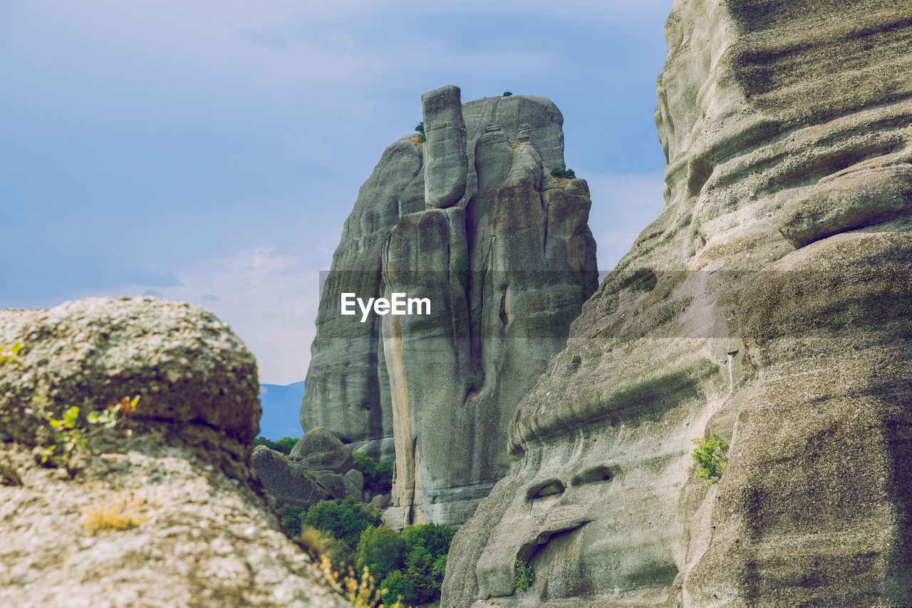 Low angle view of rock formation against sky