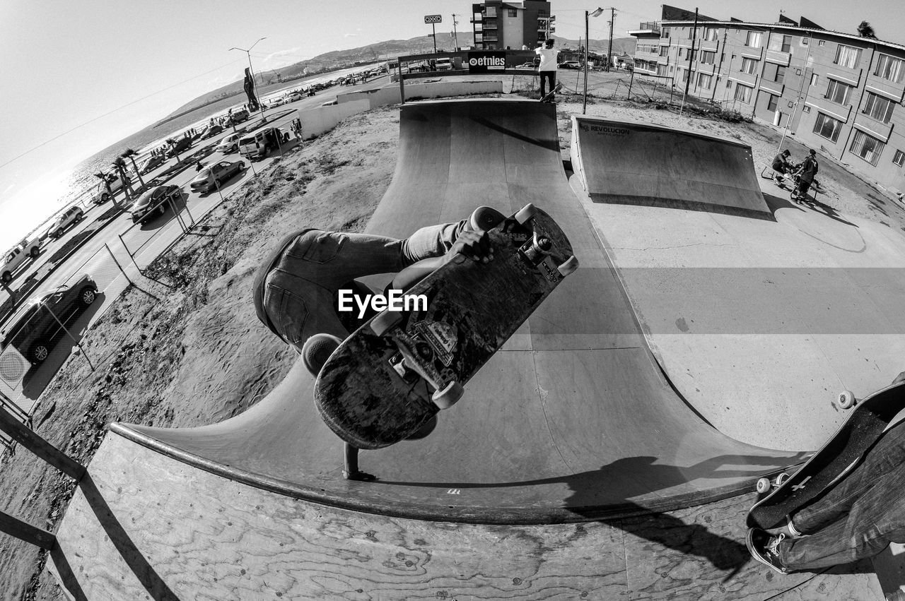 Fish-eye view of person skateboarding