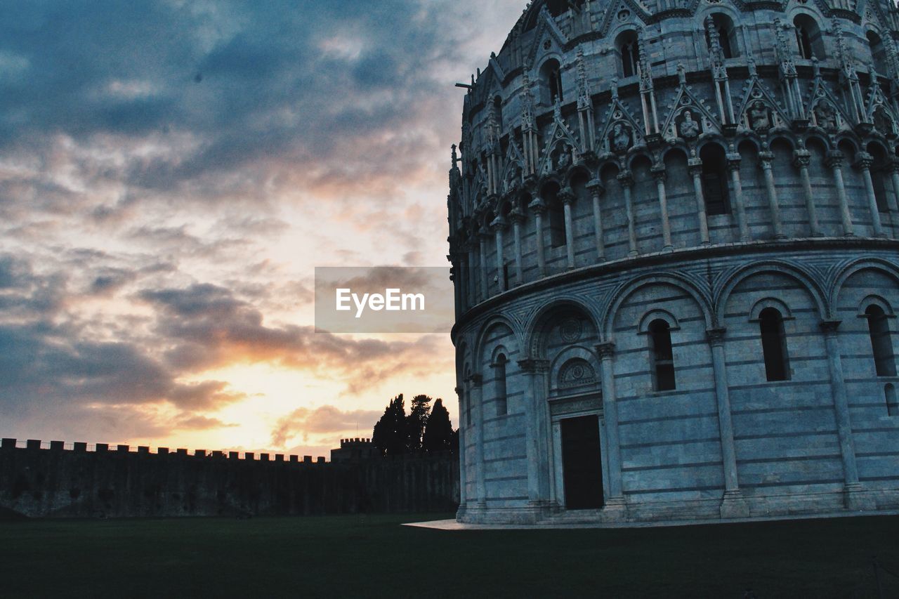 Piazza dei miracoli against sky during sunset