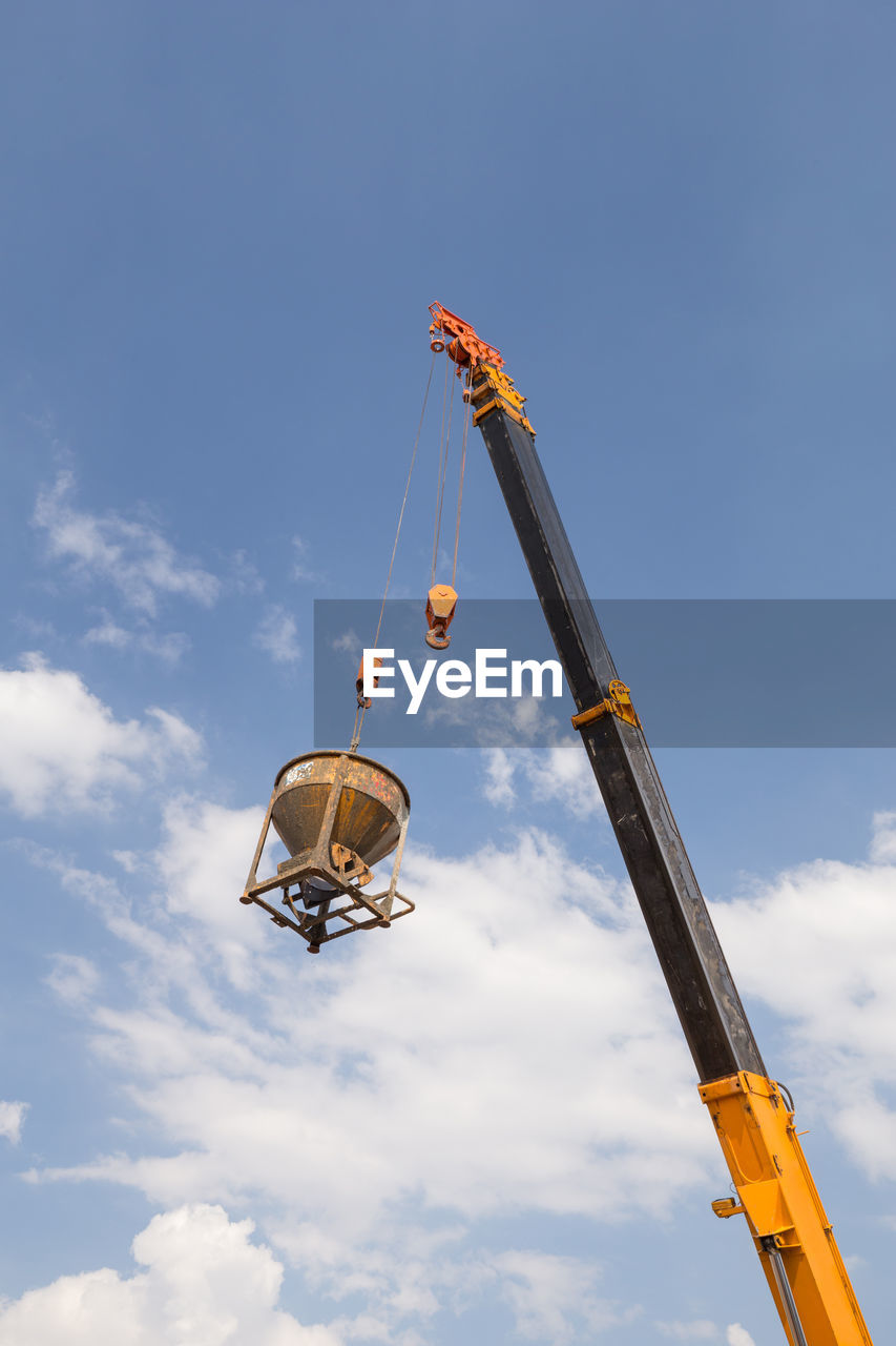 LOW ANGLE VIEW OF ROLLERCOASTER RIDE AGAINST SKY