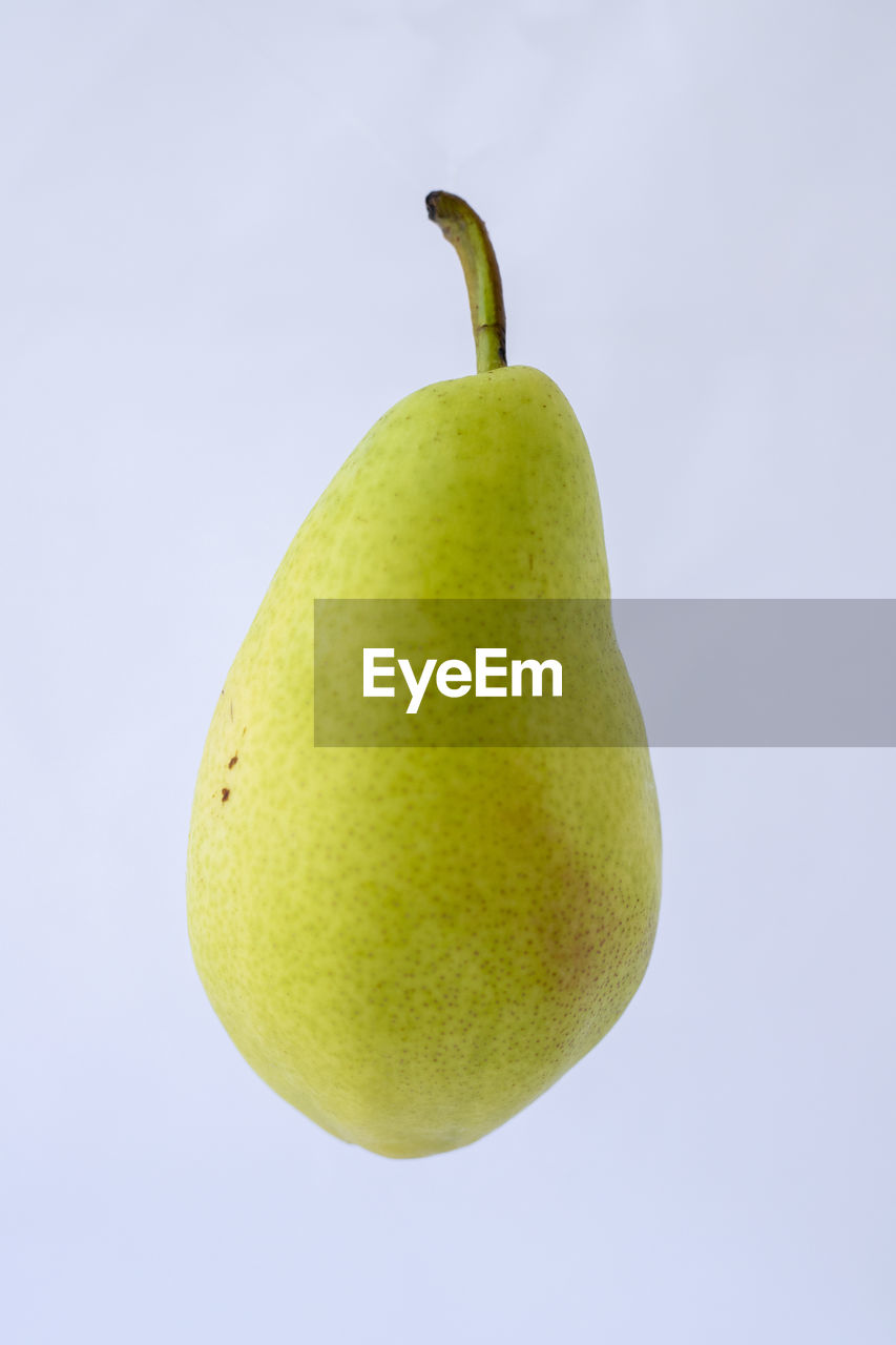 food and drink, healthy eating, food, fruit, pear, studio shot, wellbeing, produce, freshness, plant, indoors, single object, cut out, no people, yellow, fruit tree, close-up, green, white background