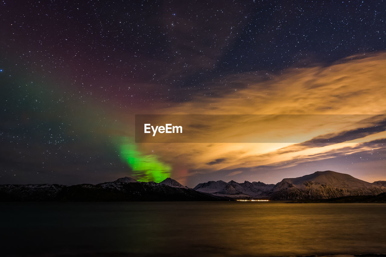 Scenic view of lake against star field at dusk