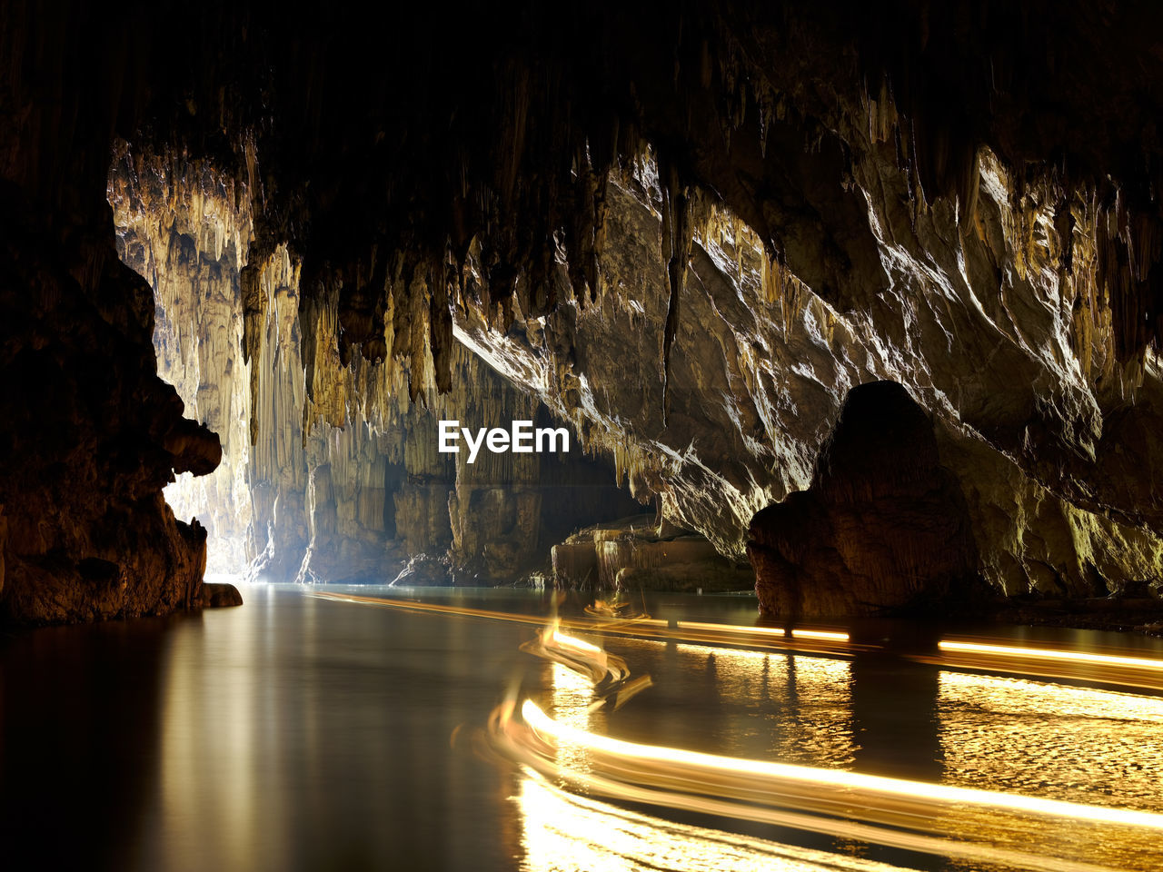 Panoramic view of sea seen through cave