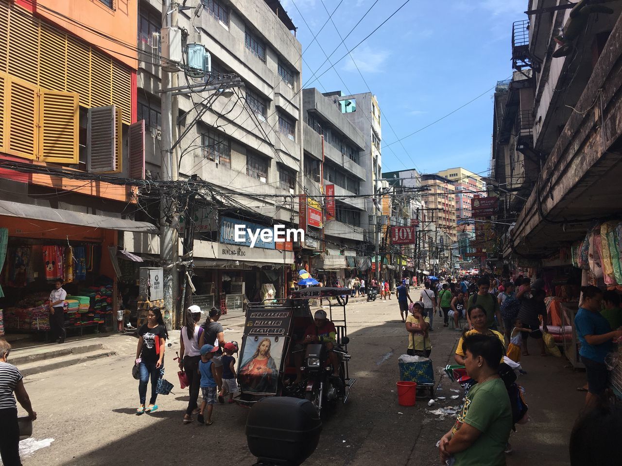 PEOPLE WALKING ON STREET IN CITY