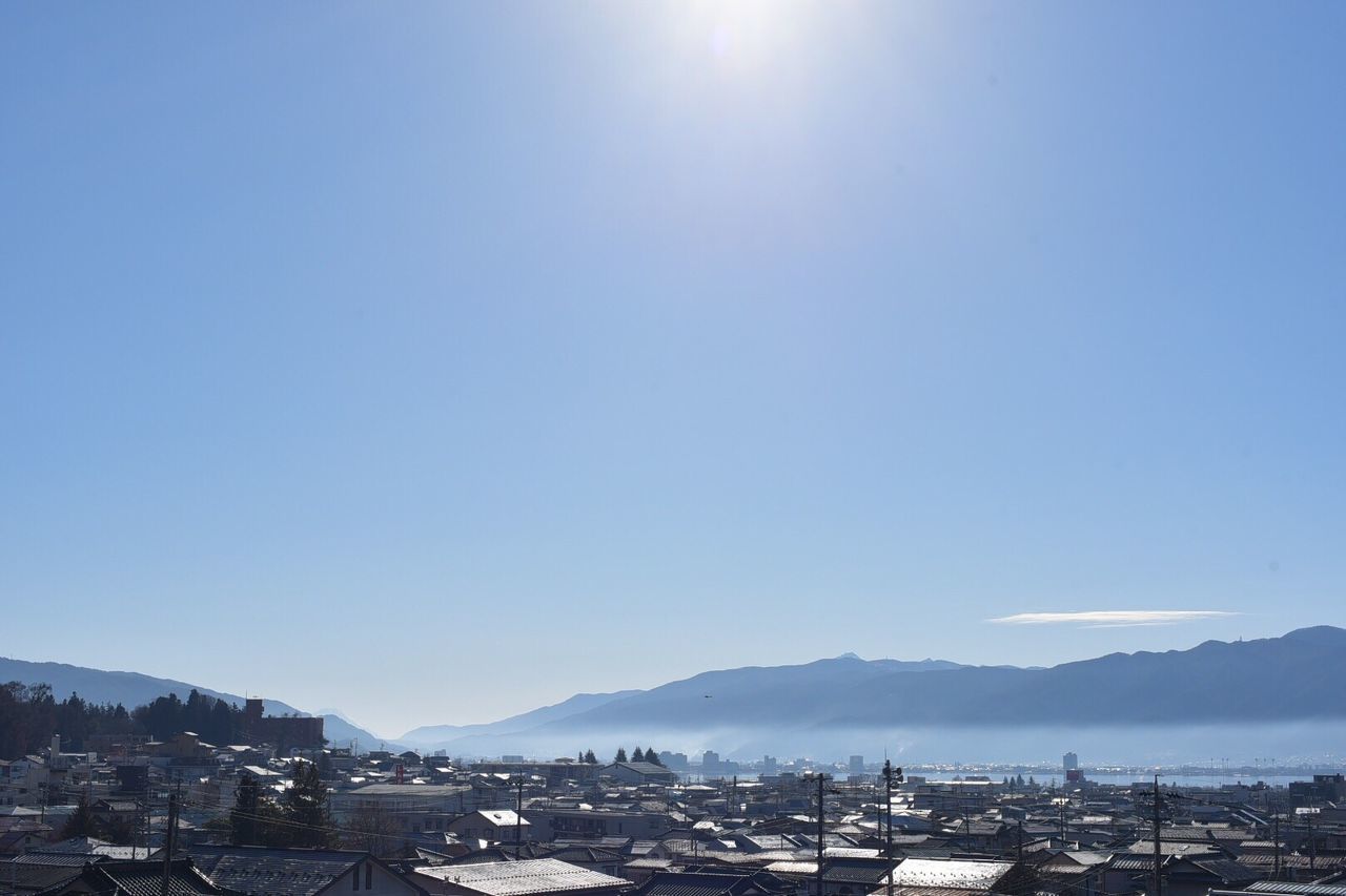 SCENIC VIEW OF CITYSCAPE AGAINST CLEAR BLUE SKY