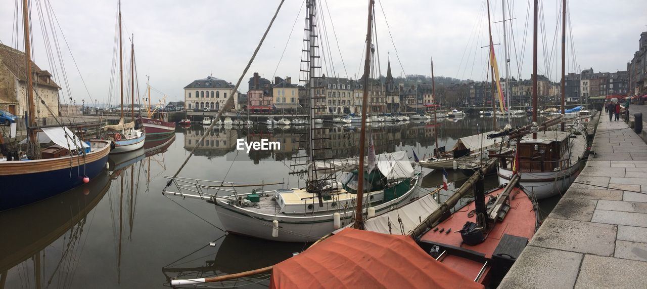 BOATS MOORED IN HARBOR