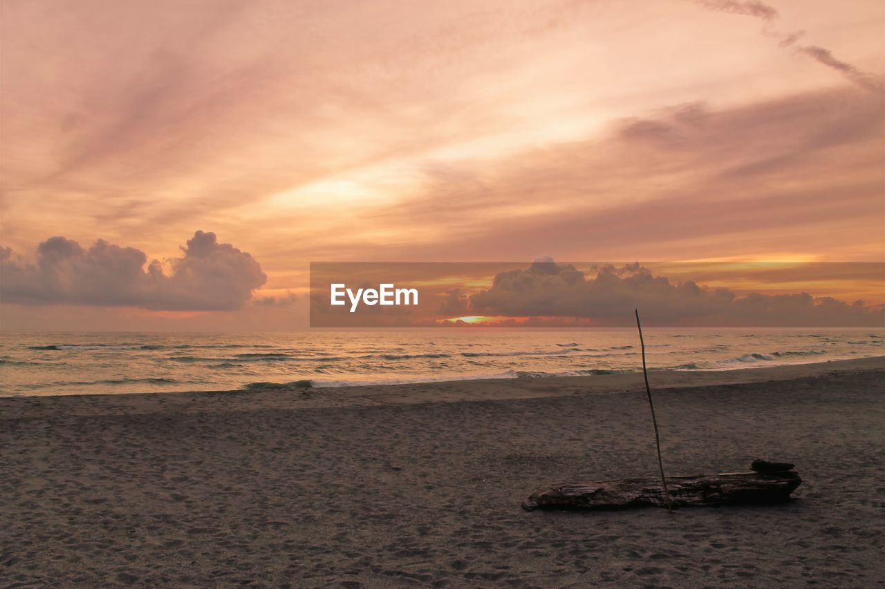 SCENIC VIEW OF SUNSET OVER SEA