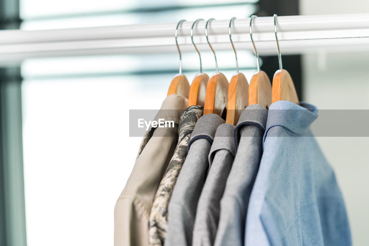 Close-up of clothes hanging on rack