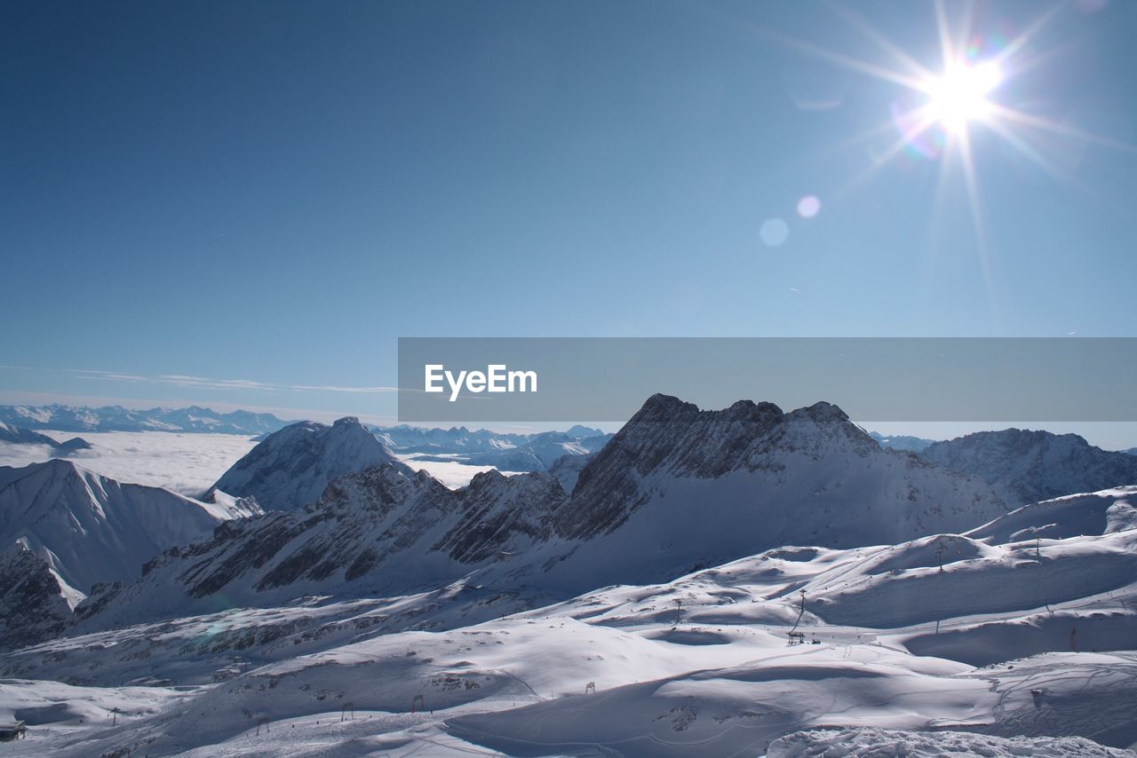 SNOWCAPPED MOUNTAINS AGAINST CLEAR SKY