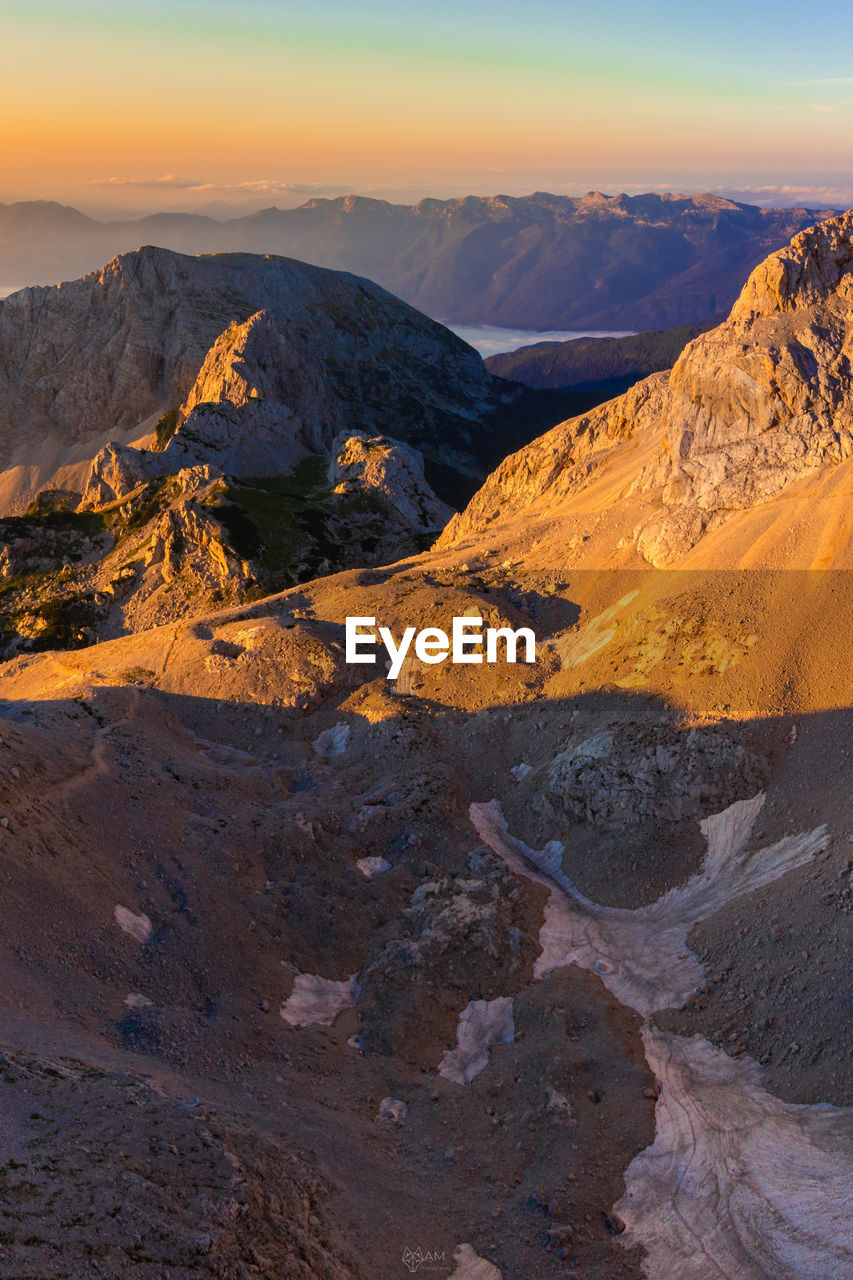 Scenic view of mountains against sky during sunset