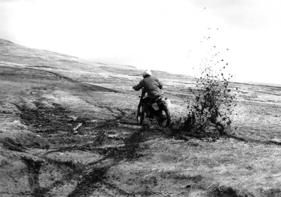 High angle view of man riding motorcycle on field