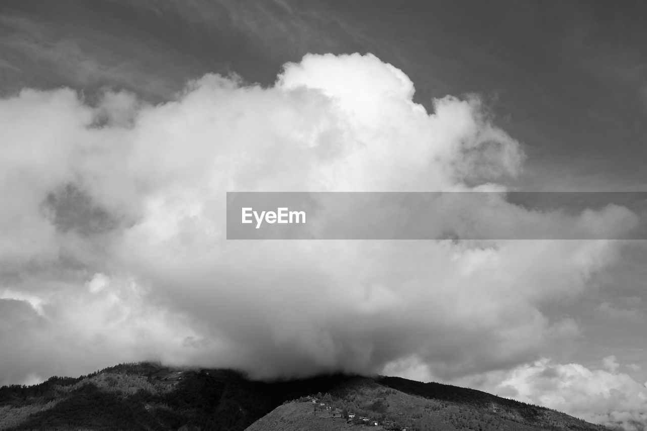 SCENIC VIEW OF CLOUDS OVER MOUNTAIN