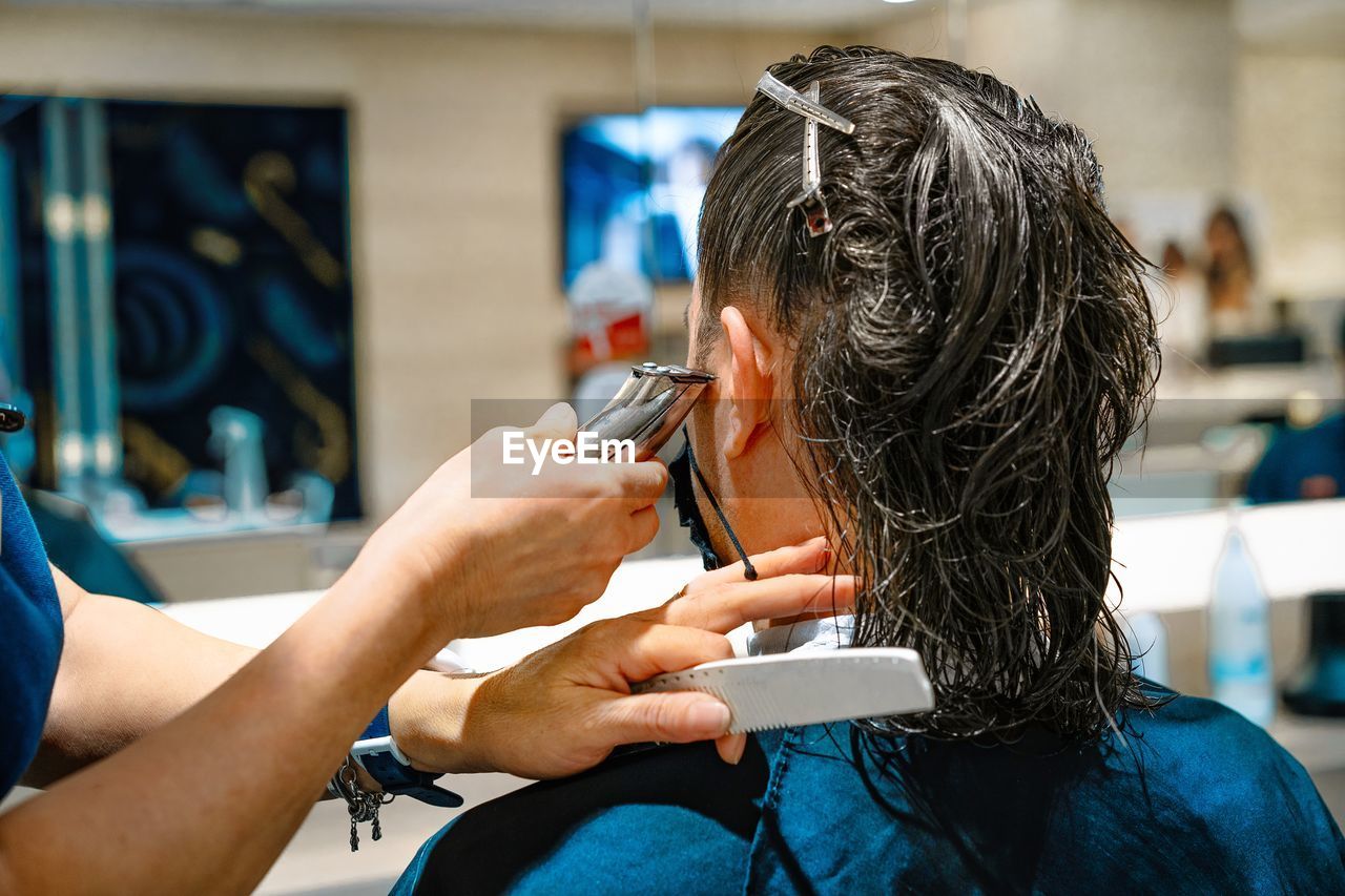 Man getting haircut at hair salon