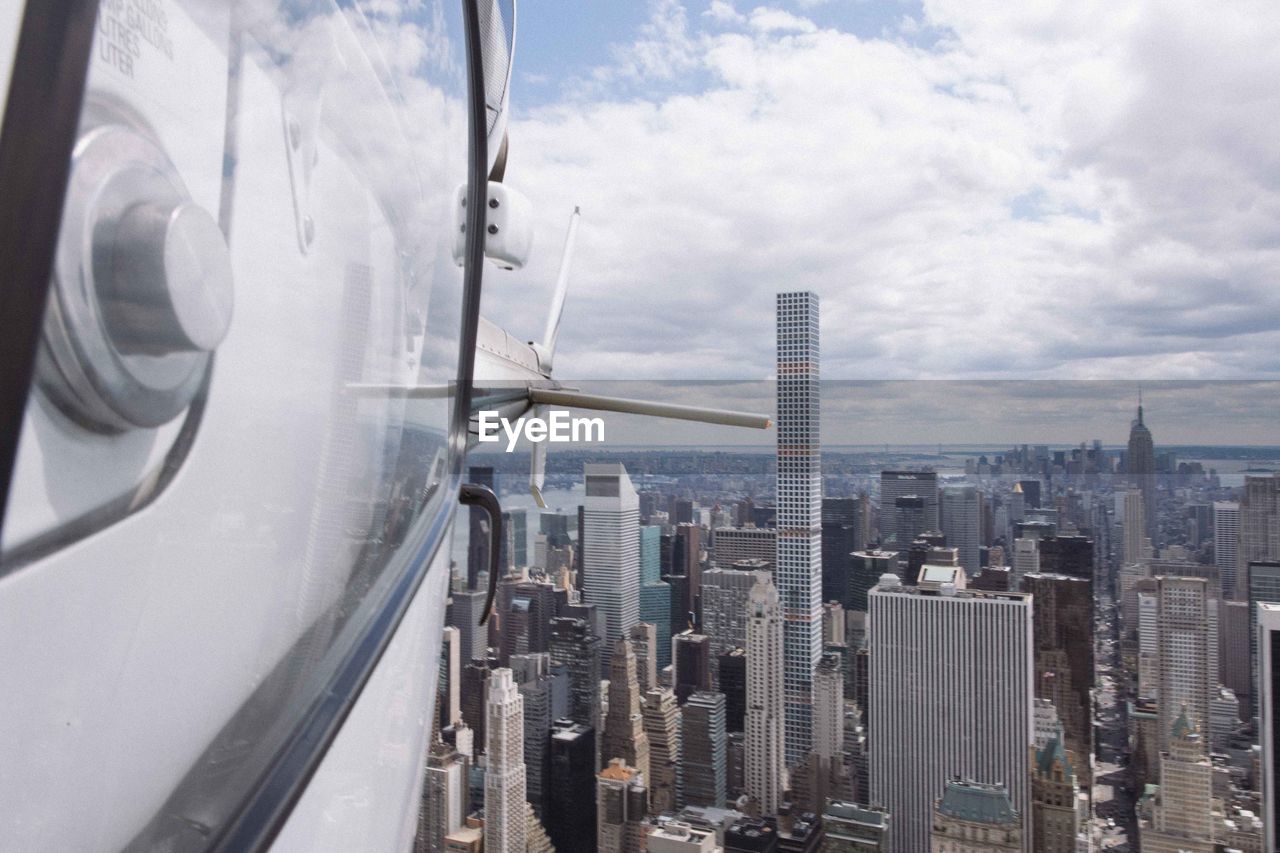 PANORAMIC VIEW OF CITY BUILDINGS AGAINST SKY