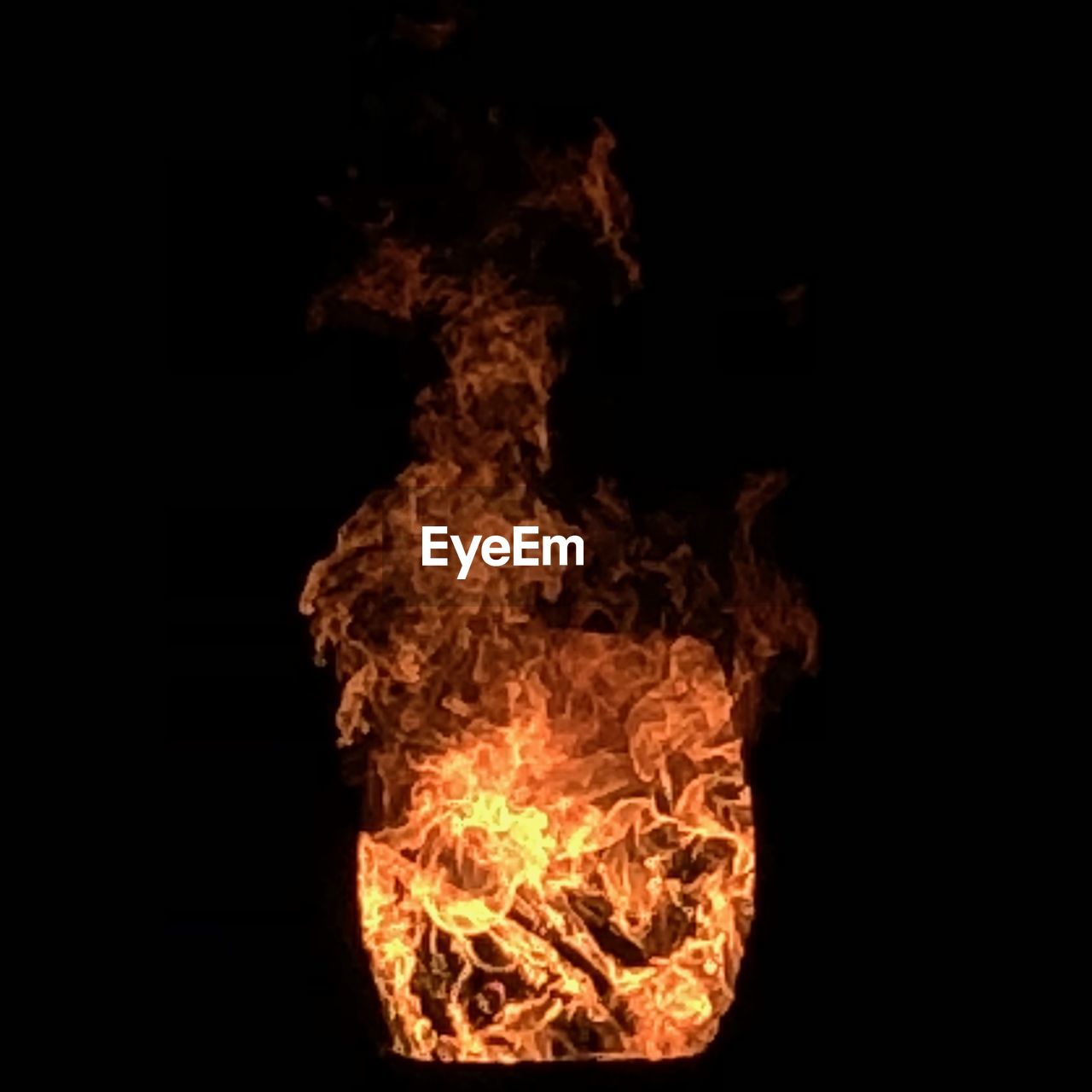 CLOSE-UP OF FIRE IN THE DARK