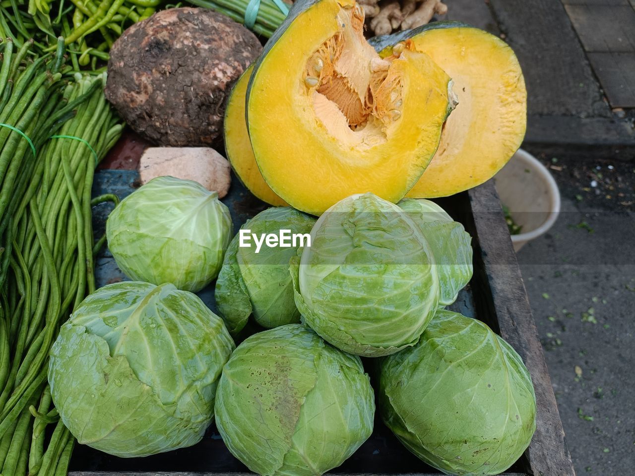 High angle view of pumpkins and cabbage for sale