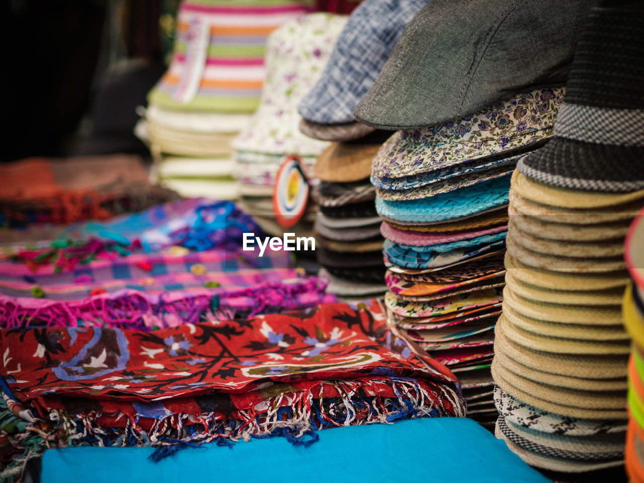 Various hats and headscarves for sale at market