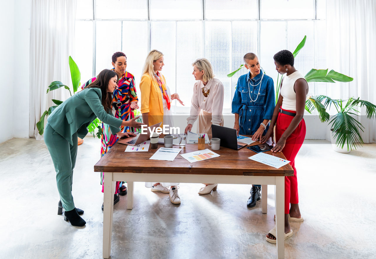 business colleagues working at desk in office