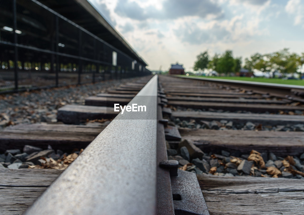 Close-up of railroad track against sky