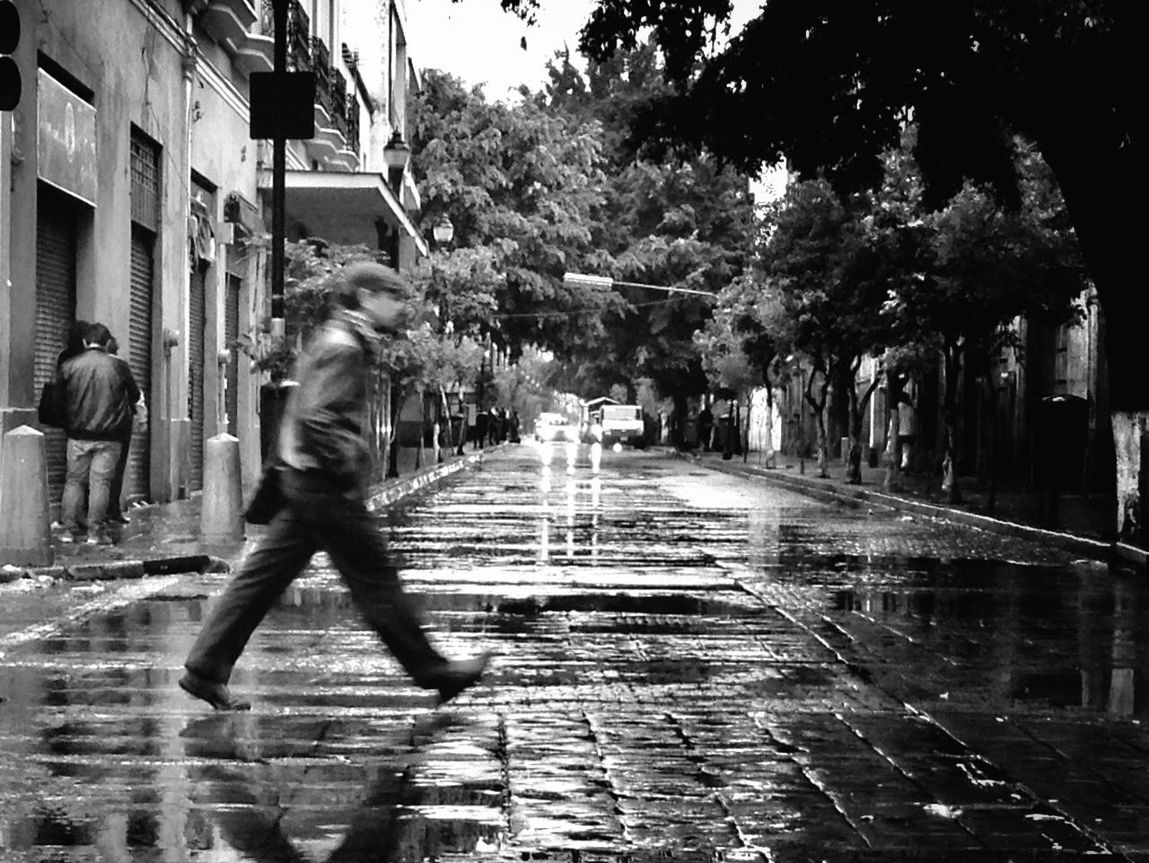 WOMAN WALKING ON FOOTPATH