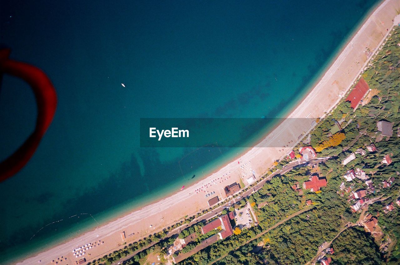 HIGH ANGLE VIEW OF SEA AGAINST LANDSCAPE