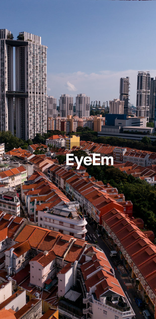 HIGH ANGLE VIEW OF MODERN BUILDINGS IN CITY