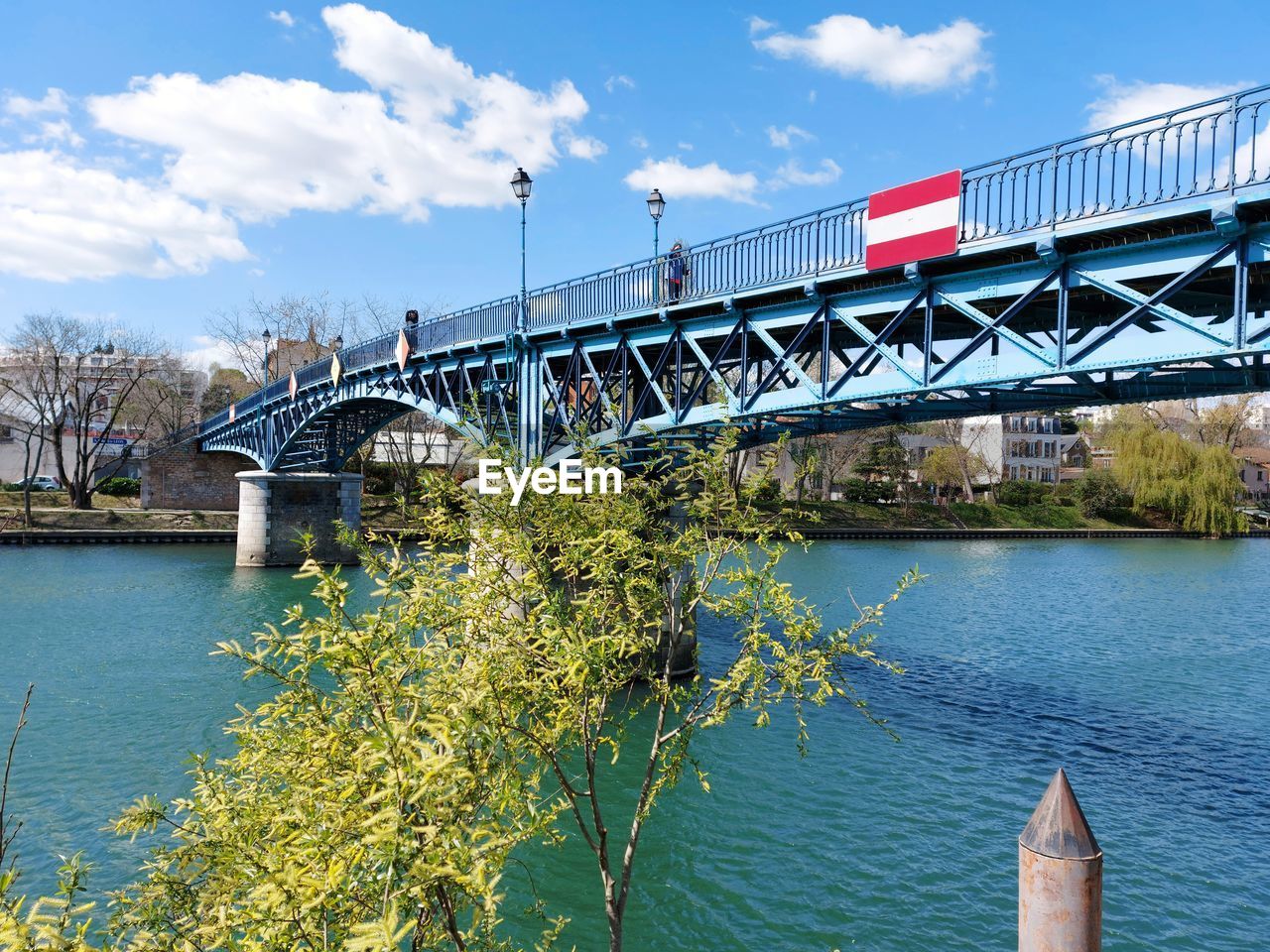 bridge, architecture, water, built structure, sky, transportation, nature, river, cloud, travel destinations, building exterior, city, travel, day, no people, waterway, outdoors, blue, tree, plant, mode of transportation, reflection, transport, tourism