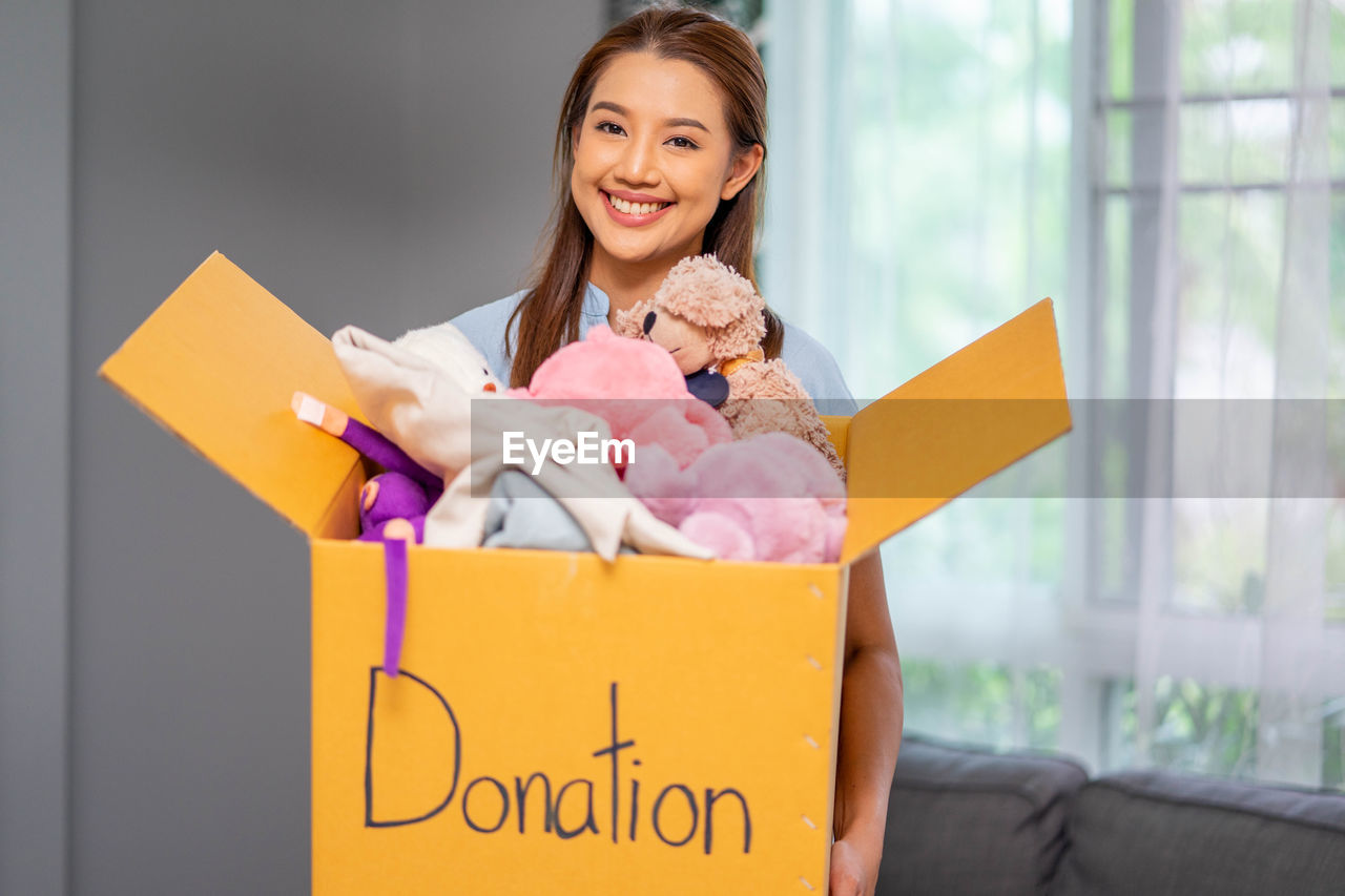 portrait of young woman with gift box