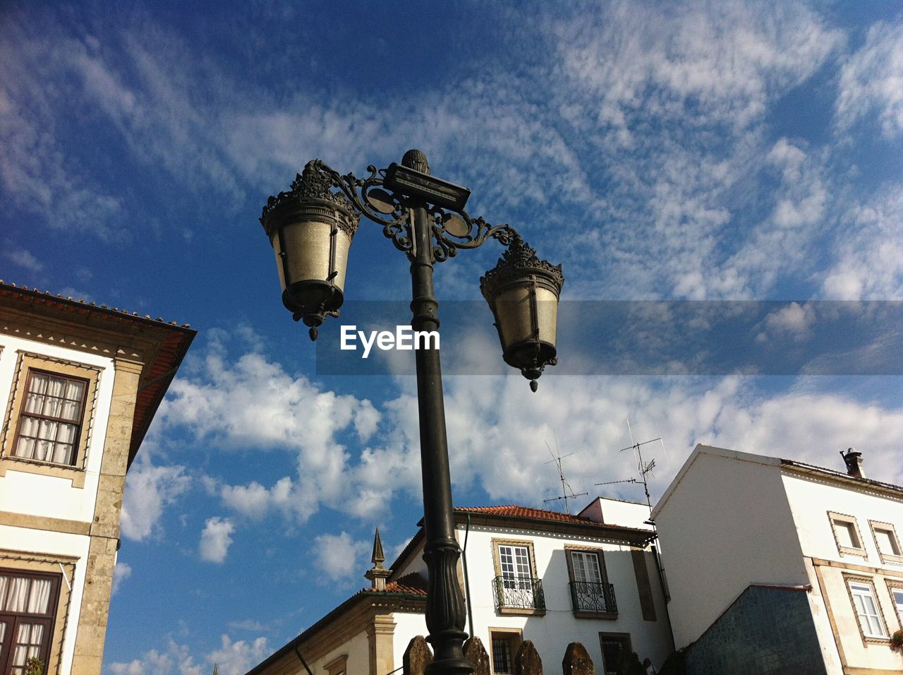 Low angle view of lamp post and built structures