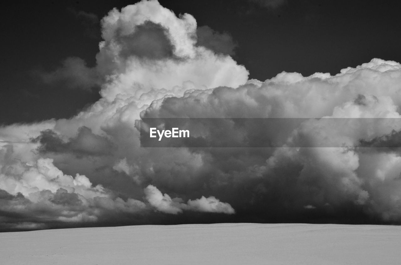 SCENIC VIEW OF CLOUDS OVER SEA AGAINST SKY