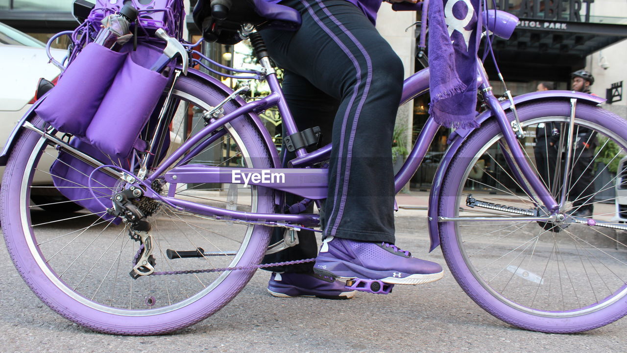 LOW SECTION OF BICYCLE PARKED AGAINST BLUE SKY