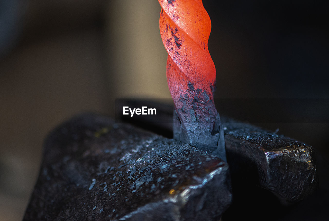 Close-up of hot metal on anvil in blacksmith workshop