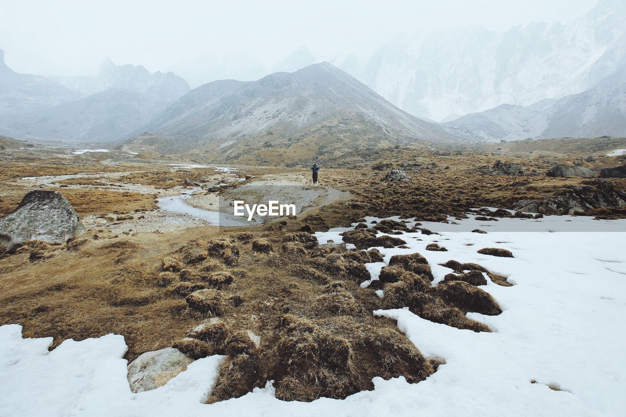 Scenic view of snow covered mountains