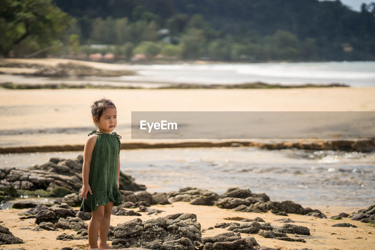 Portrait of girl standing on beach