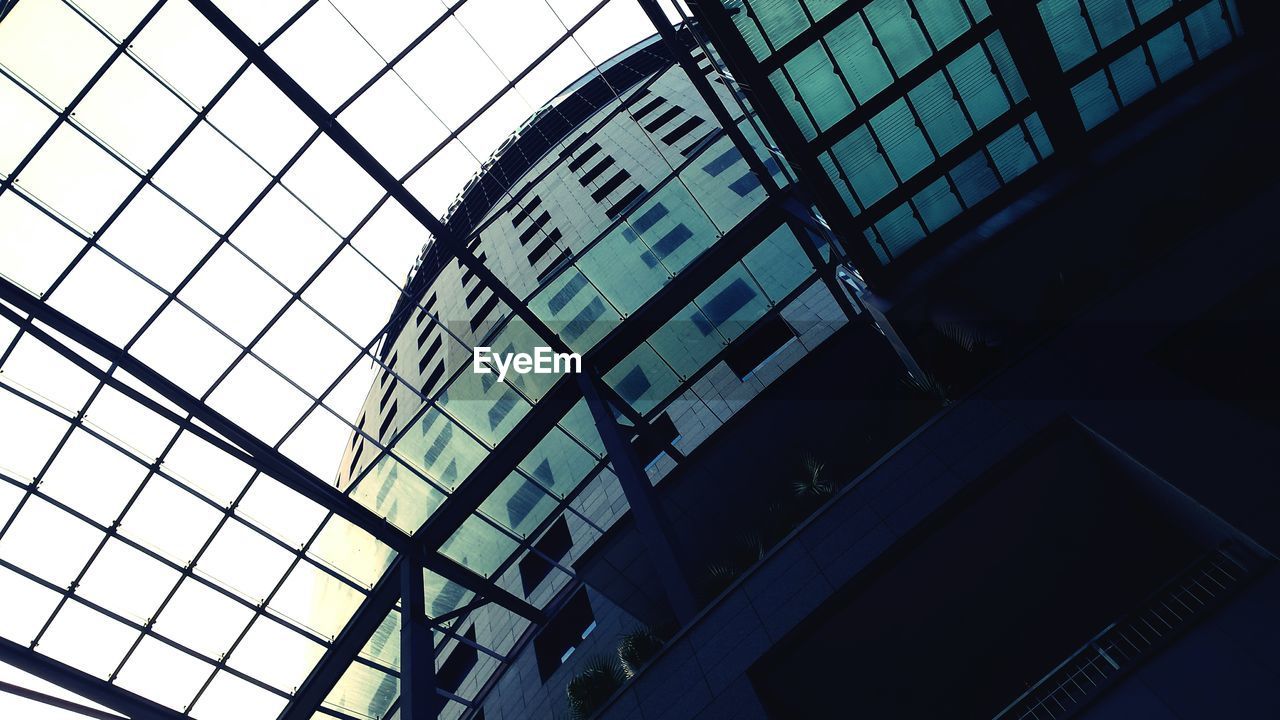 Low angle view of building seen through sky light