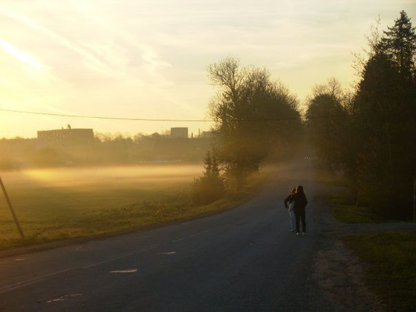 WOMAN WALKING ON ROAD
