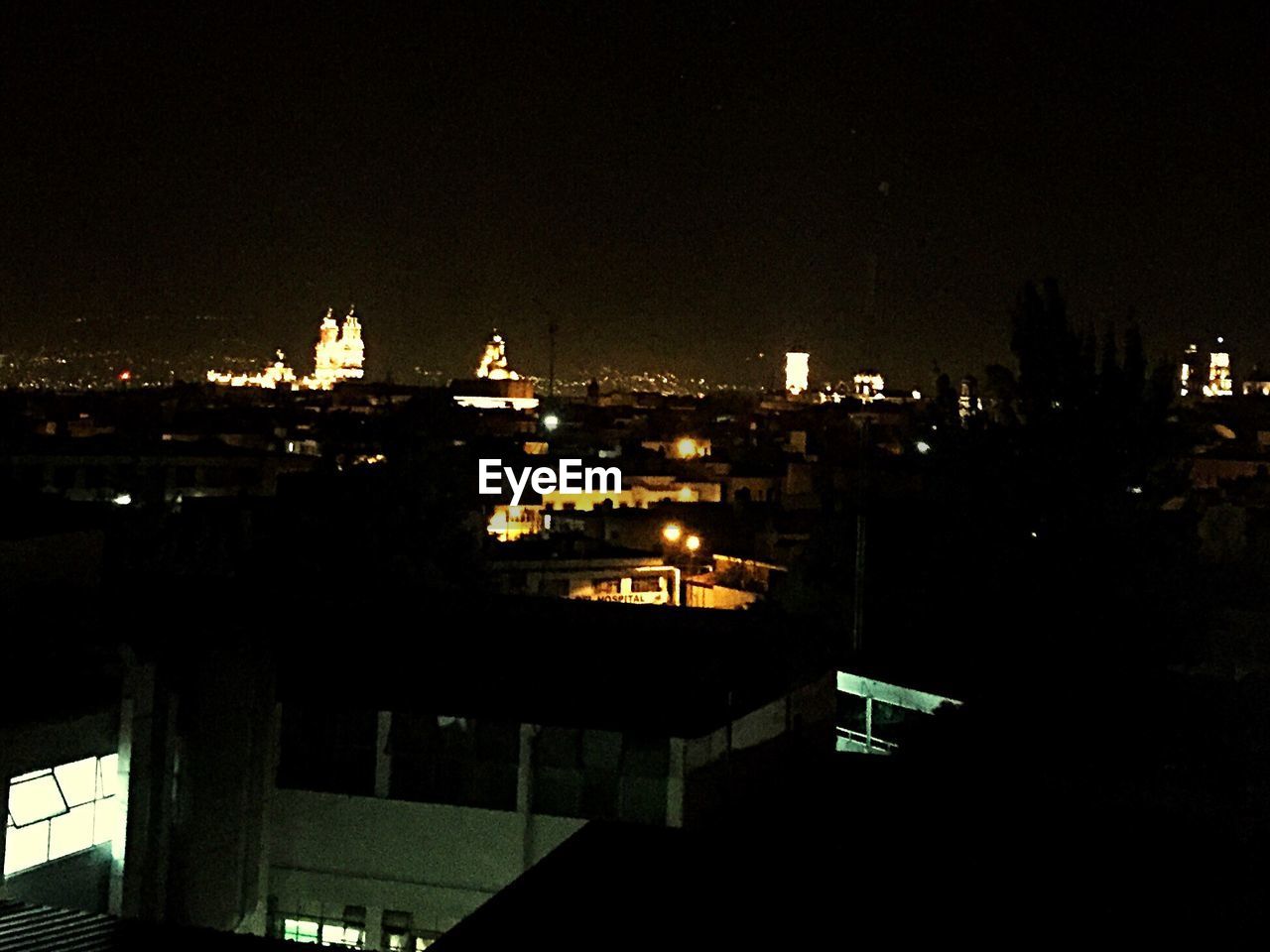 VIEW OF ILLUMINATED BUILDINGS AT NIGHT