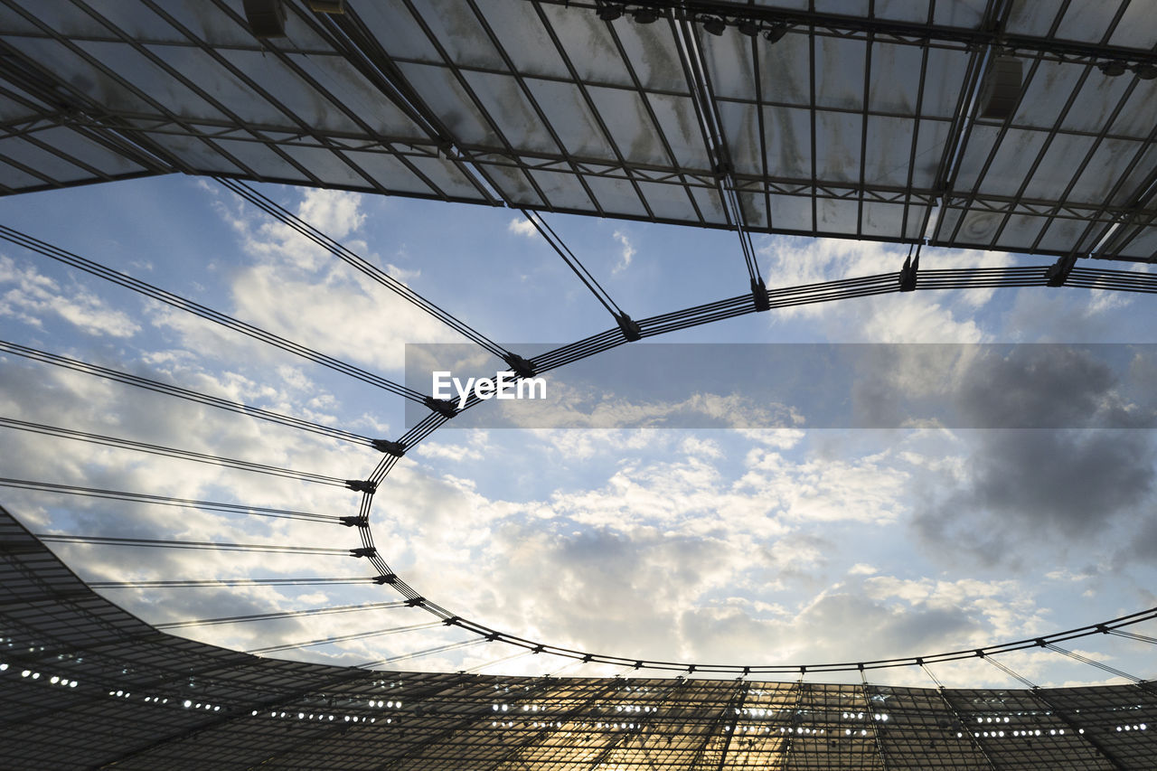 Low angle view of modern buildings against sky.  from inside a football stadium.