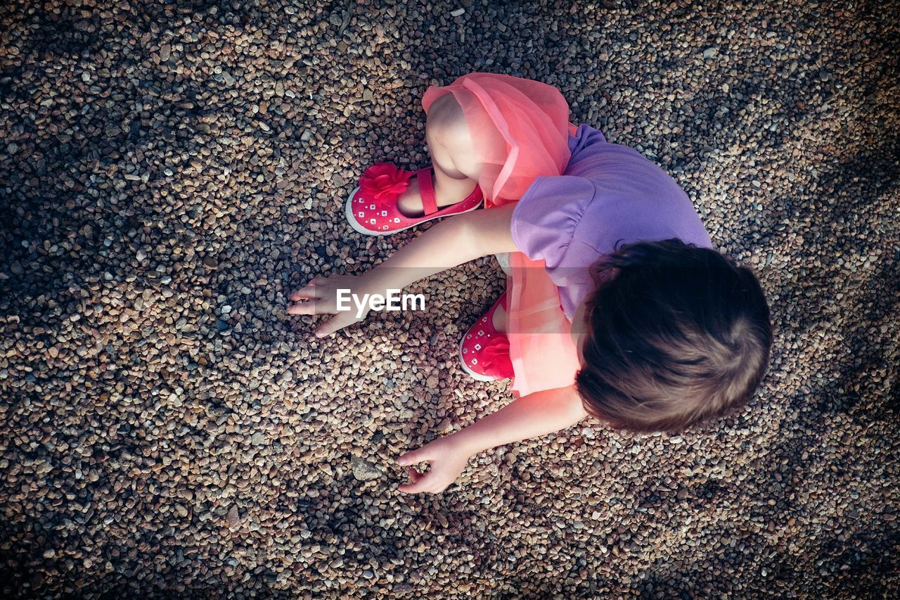 High angle view of girl playing outdoors