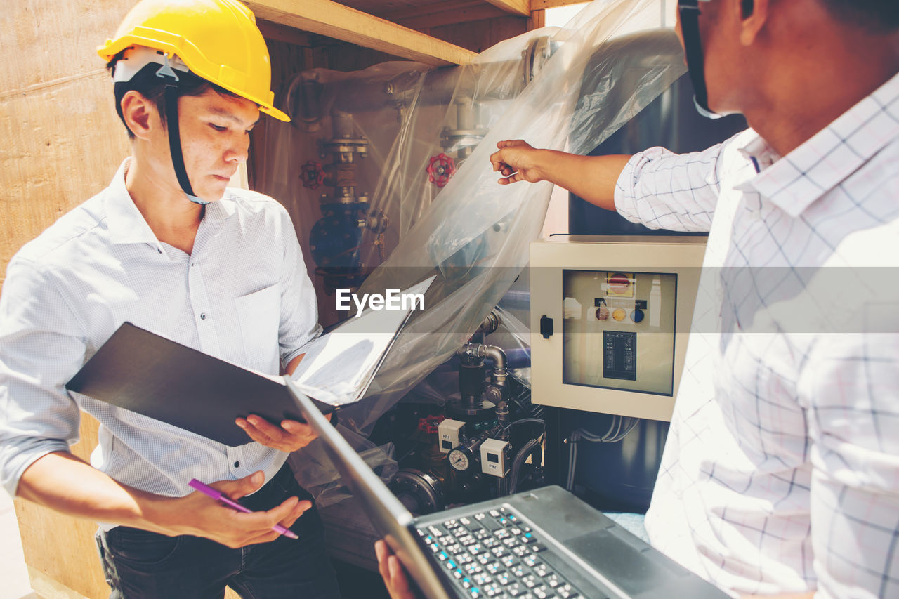 Project engineer, engineer and technician working on construction site